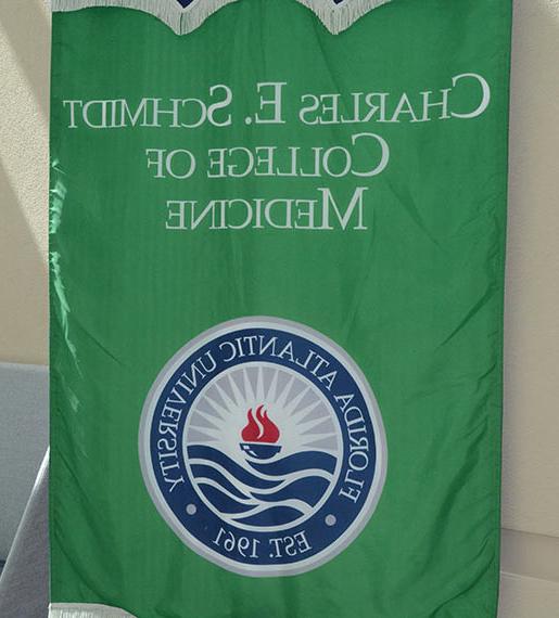 FAU Schmidt College of Medicine banner hanging inside of atrium entrance